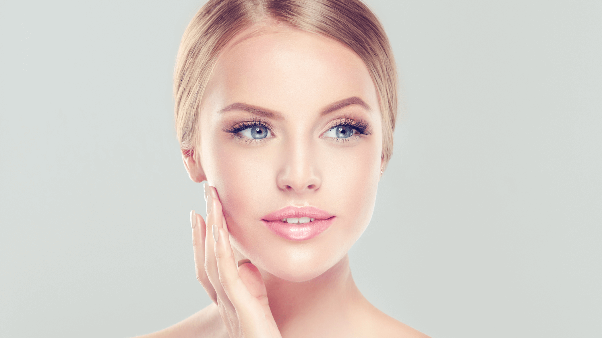 woman touching her face
